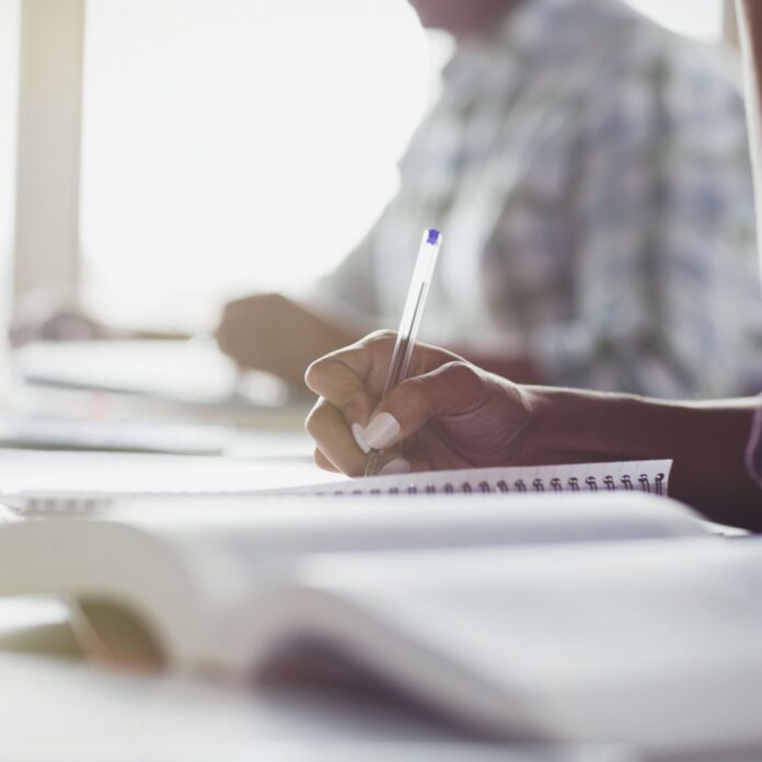 students-taking-notes-in-adult-education-classroom-595349131-591f251c3df78cf5fafb0c11
